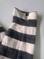 Black and white striped fabric on a gray background