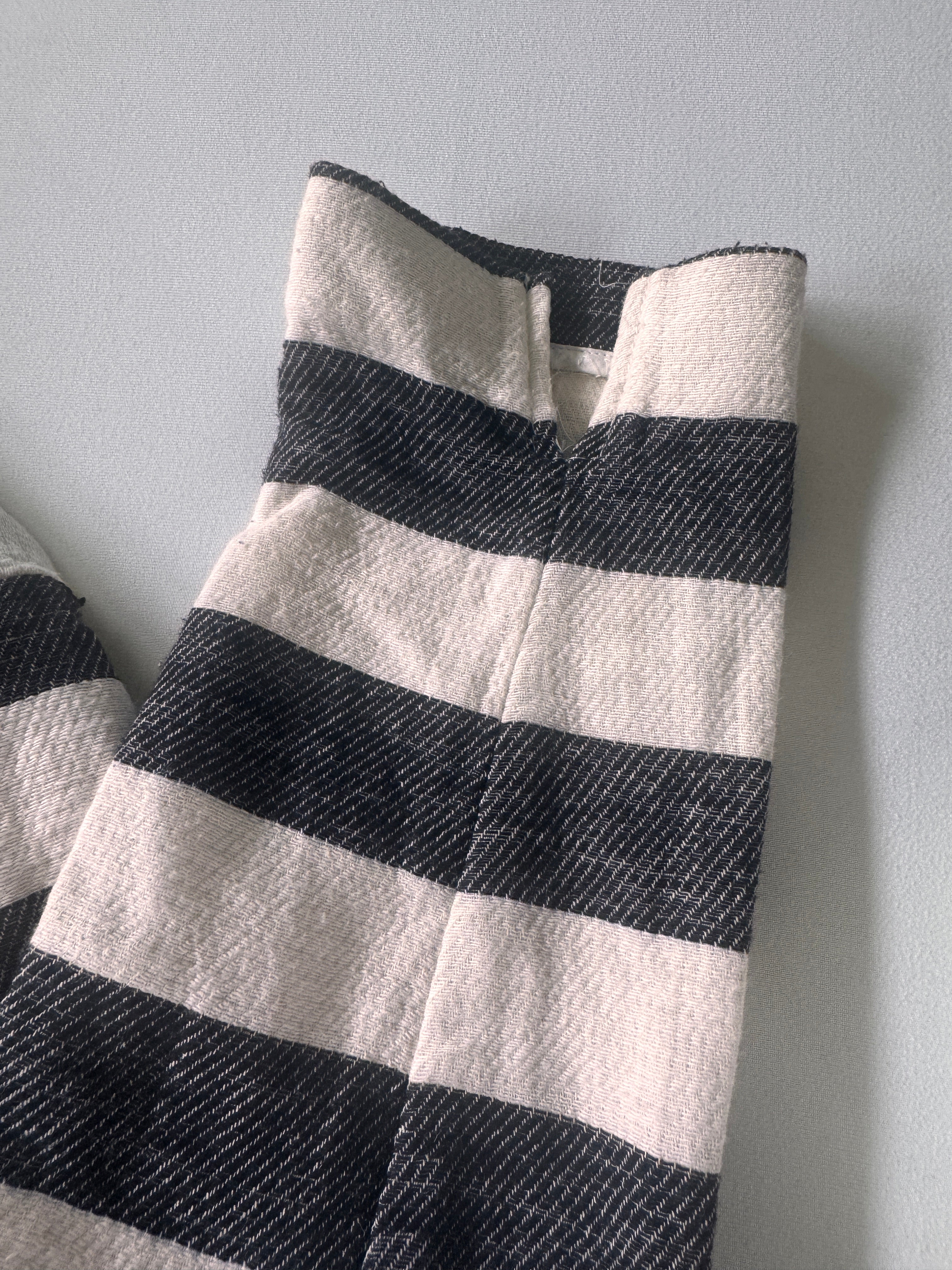 Black and white striped fabric on a gray background