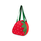 Strawberry-shaped bag with green handle on a white background
