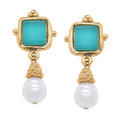 Gold earrings with turquoise square stones and white pearls on a white background