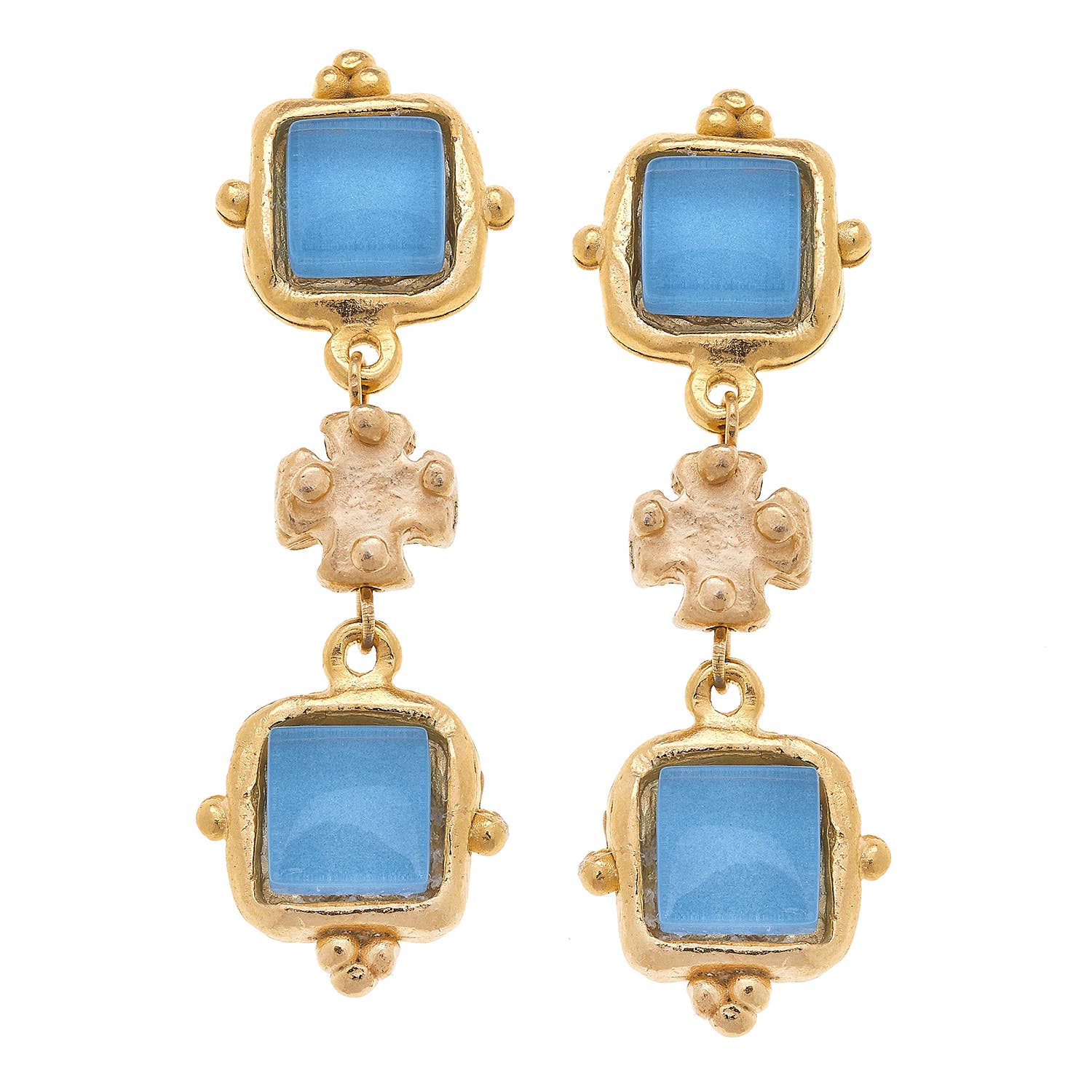 Gold earrings with blue gemstones on a white background