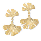 Gold leaf-shaped earrings on a white background