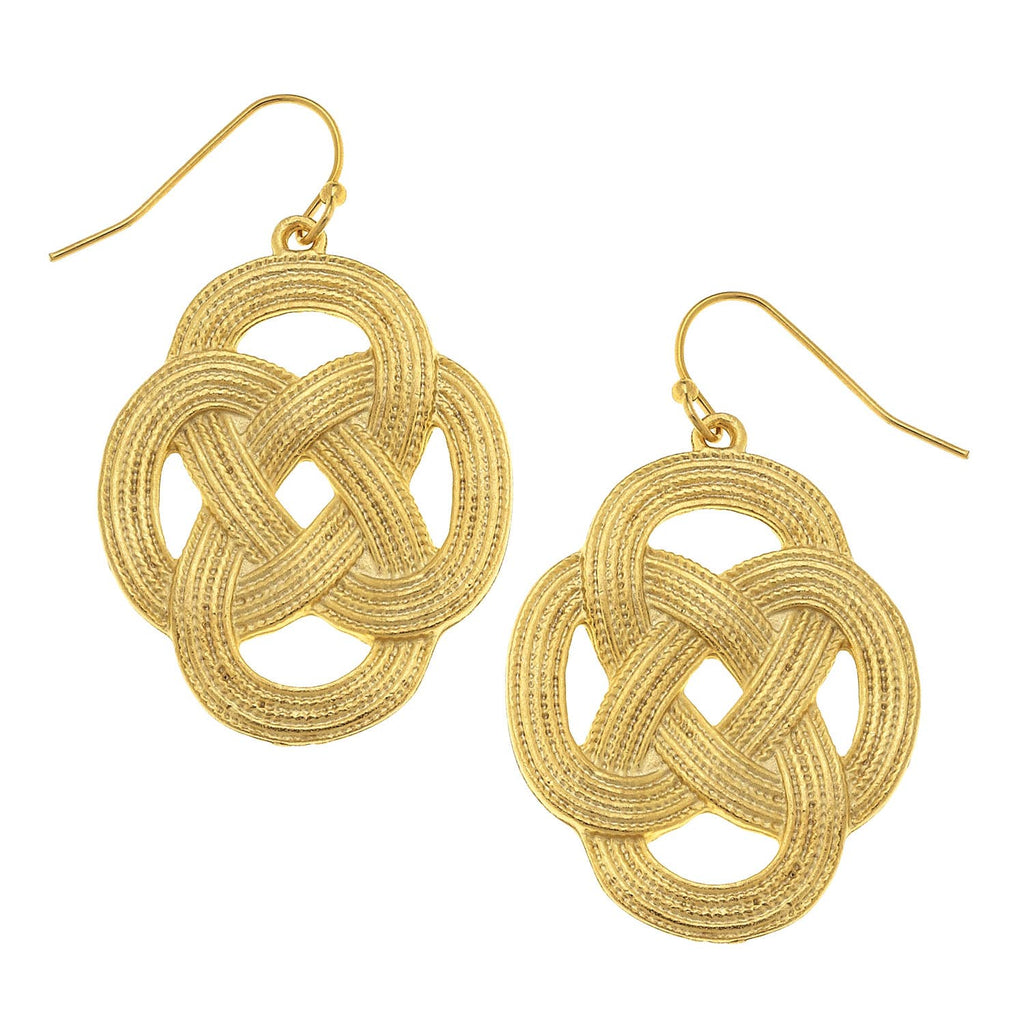 Gold Celtic knot earrings on a white background
