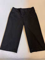 Black pants on a light beige background