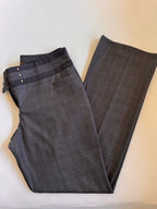 Folded plaid pants on a light colored background