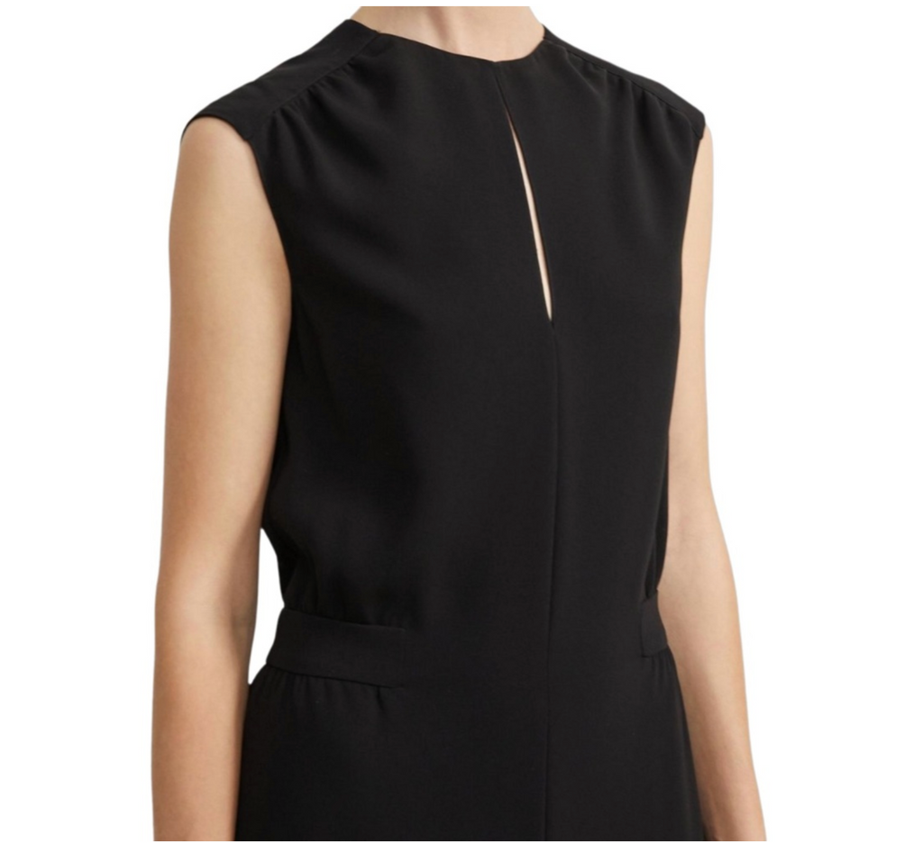Black sleeveless dress with a cutout detail on a white background