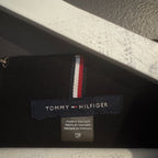 Tommy Hilfiger label on a product with a gray background
