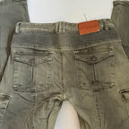 Green jeans with a brown tag on a white background