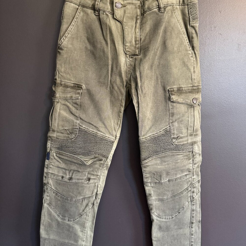Greenish-brown pants with patchwork design on a gray background