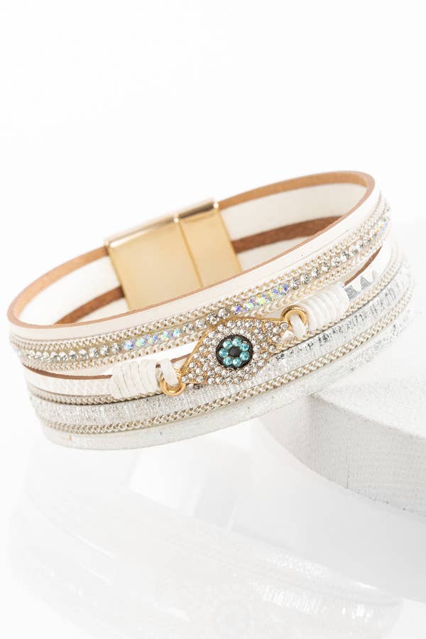 Multistrand bracelet with gold accents and gemstones on a white background