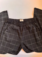 Windowpane black and white pants on a light colored background
