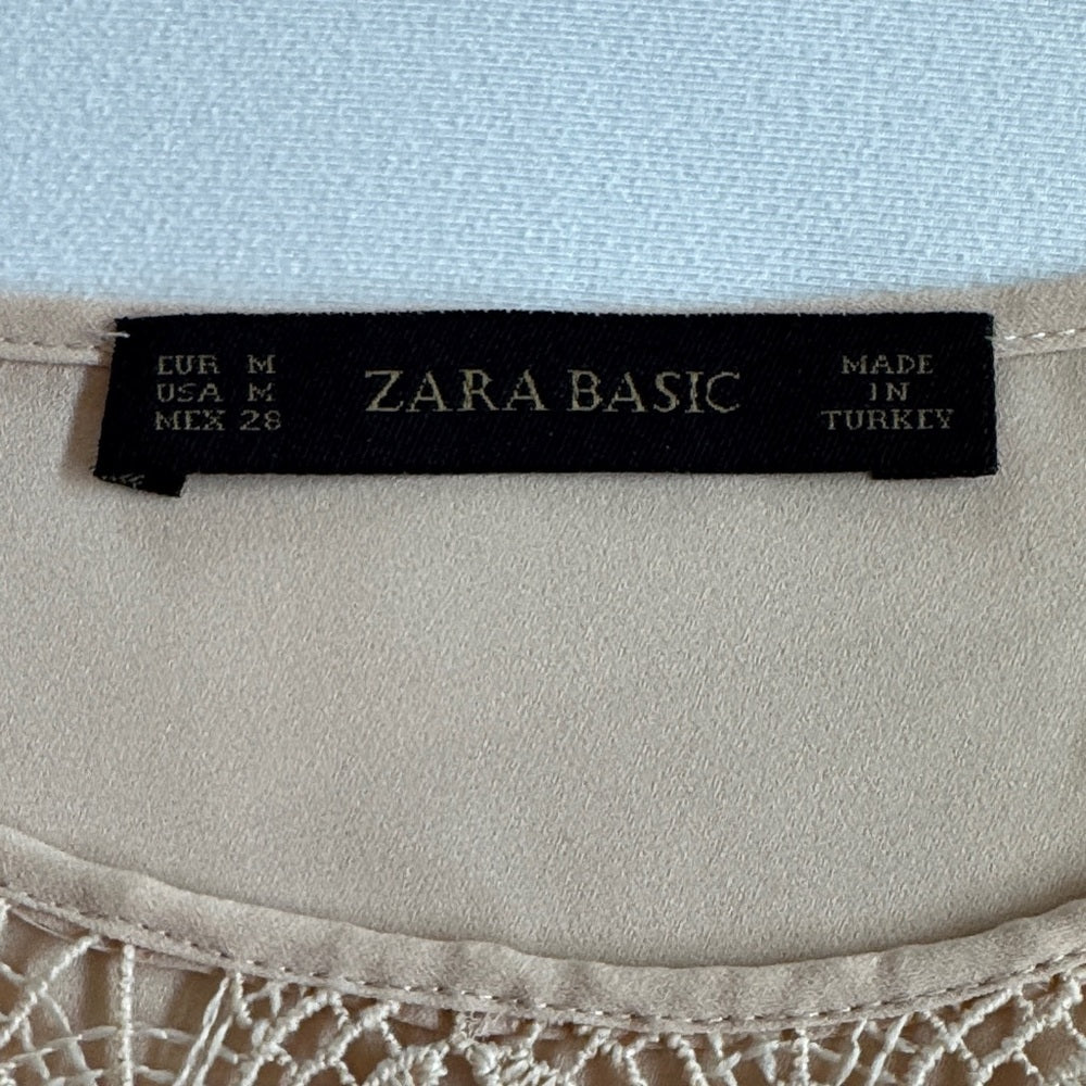 Zara Basic label on a garment with a light blue background