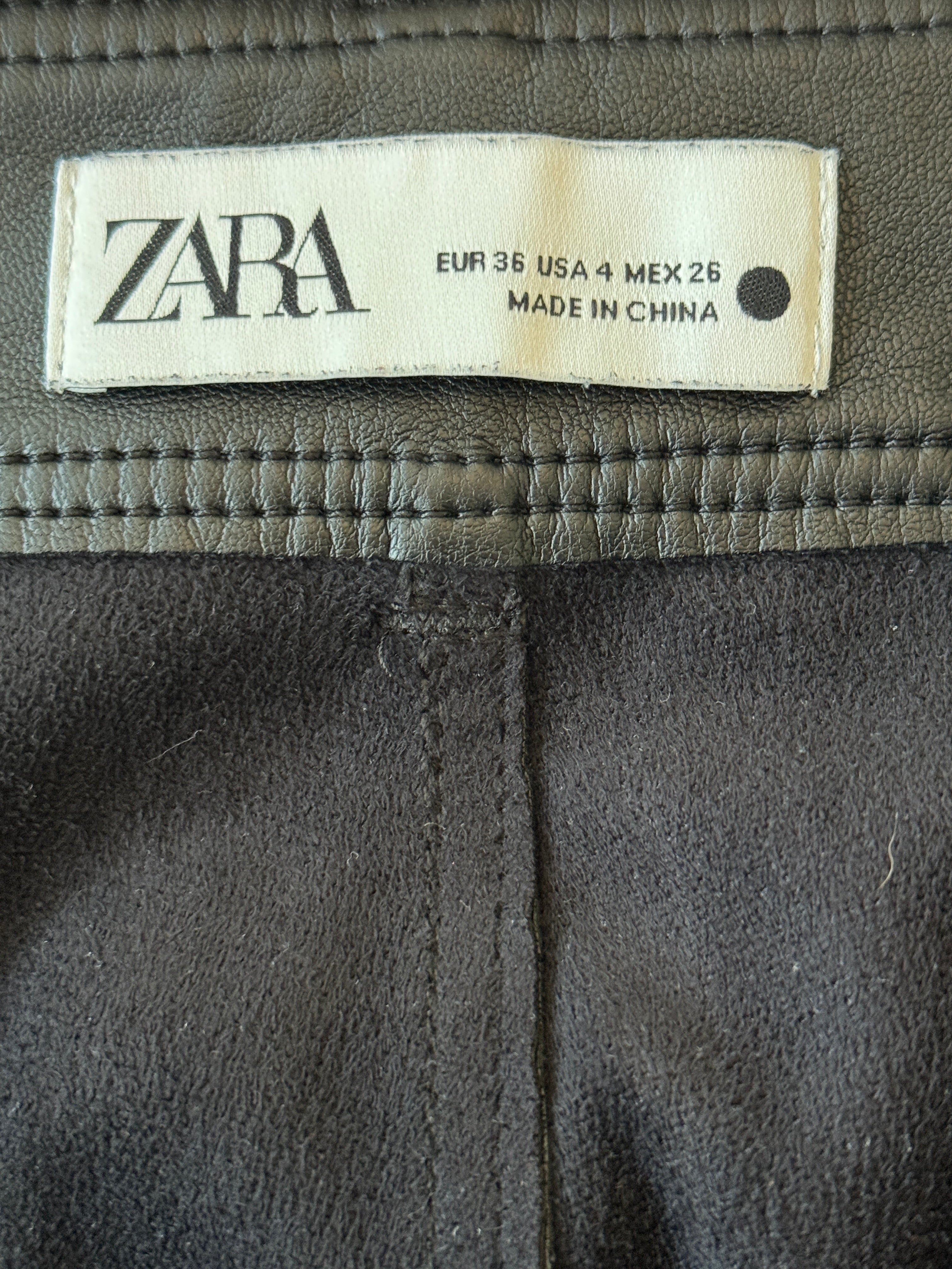 Zara label on a dark fabric background