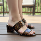 Ann Taylor tortoiseshell sandals on woman's foot