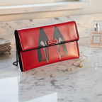 Kent Stetson Red Shoe Envelope Clutch in elegant setting