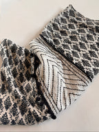 Black and white patterned fabric on a light background